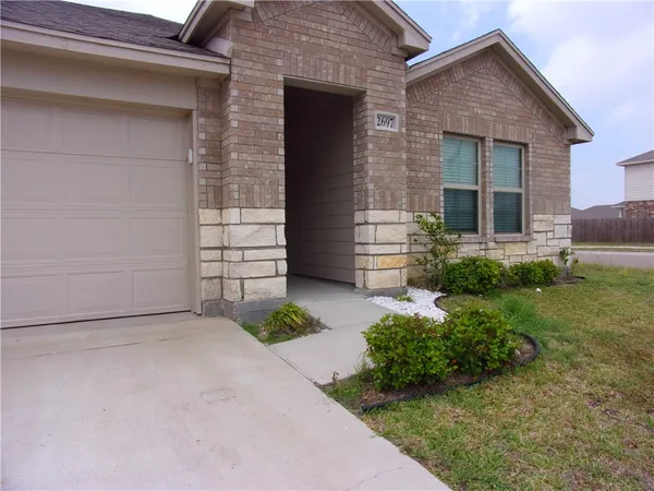 front view of a house with a yard