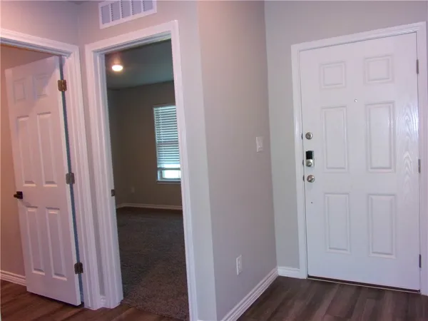 a view of small space with wooden floor