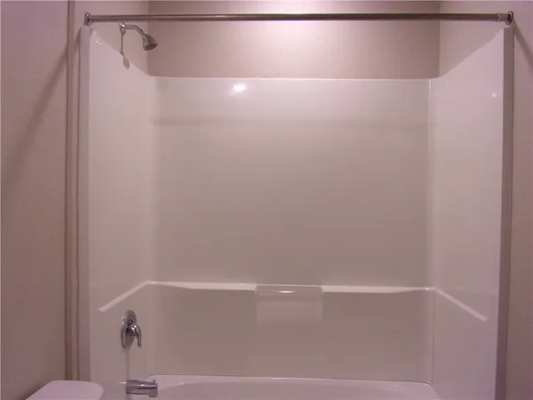 a view of an empty room and a window