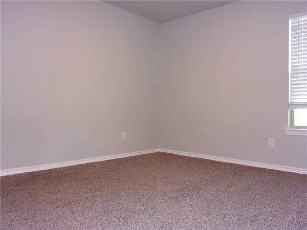 en empty room with windows