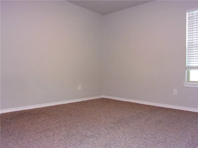 en empty room with windows