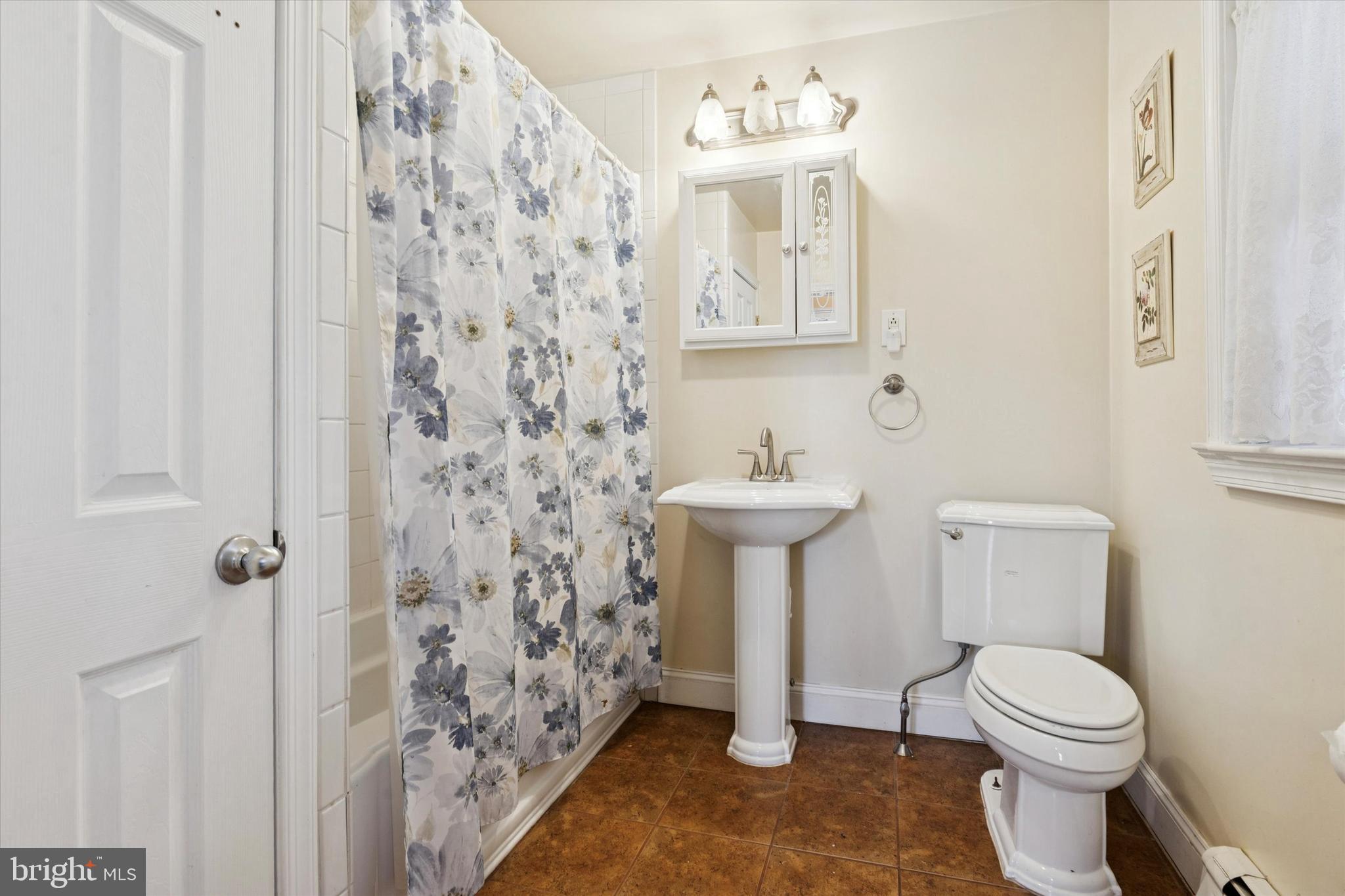 613 Convent Road Aston, PA 19014 - Photo 18 of 25 a bathroom with a toilet sink vanity and shower