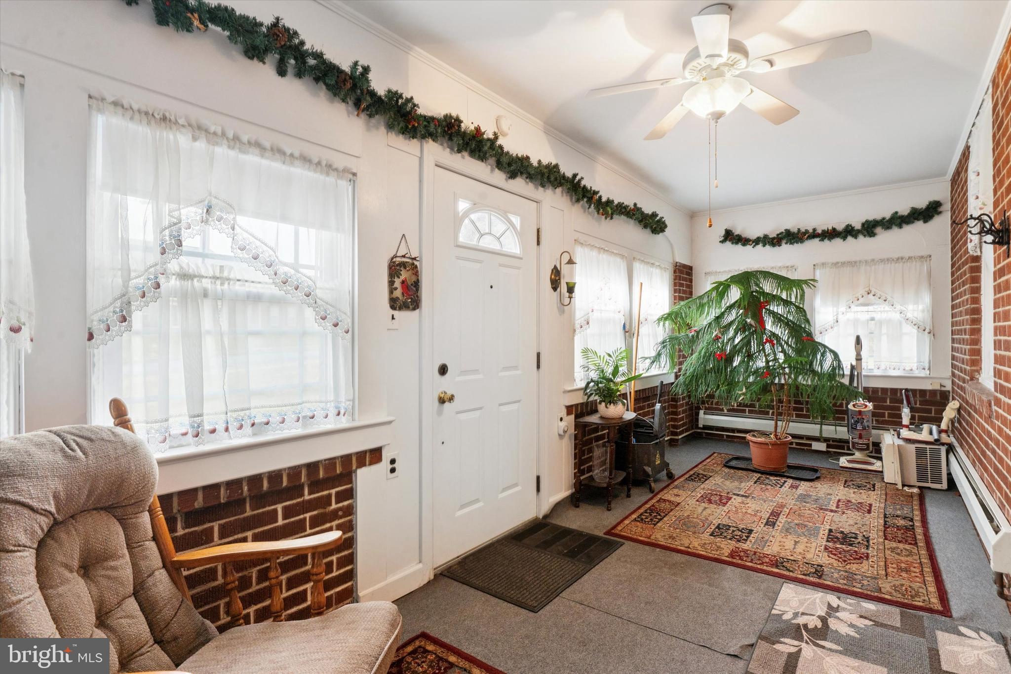 613 Convent Road Aston, PA 19014 - Photo 4 of 25 a living room with furniture a window and a chandelier