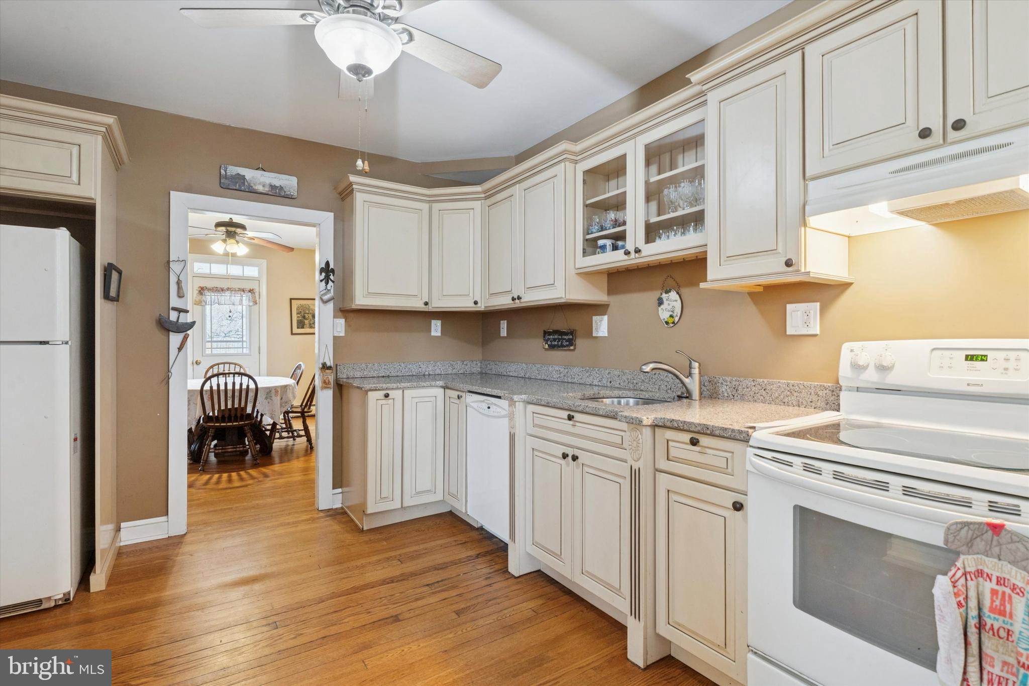 613 Convent Road Aston, PA 19014 - Photo 9 of 25 a kitchen with granite countertop a stove a sink and a refrigerator