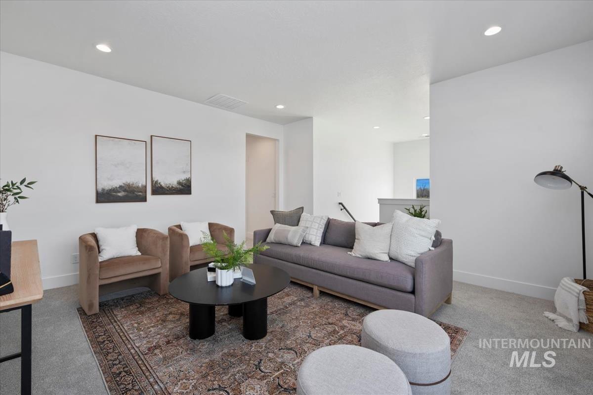 749 South Calhoun Lane Star, ID 83669 - Photo 8 of 34 Carpeted living room featuring recessed lighting and baseboards