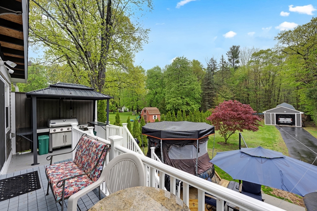 156 Olean Street Worcester, MA 01602 - Photo 15 of 37 a view of a patio with furniture and a backyard
