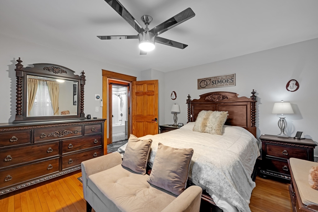 156 Olean Street Worcester, MA 01602 - Photo 17 of 37 a bedroom with a bed and wooden floor