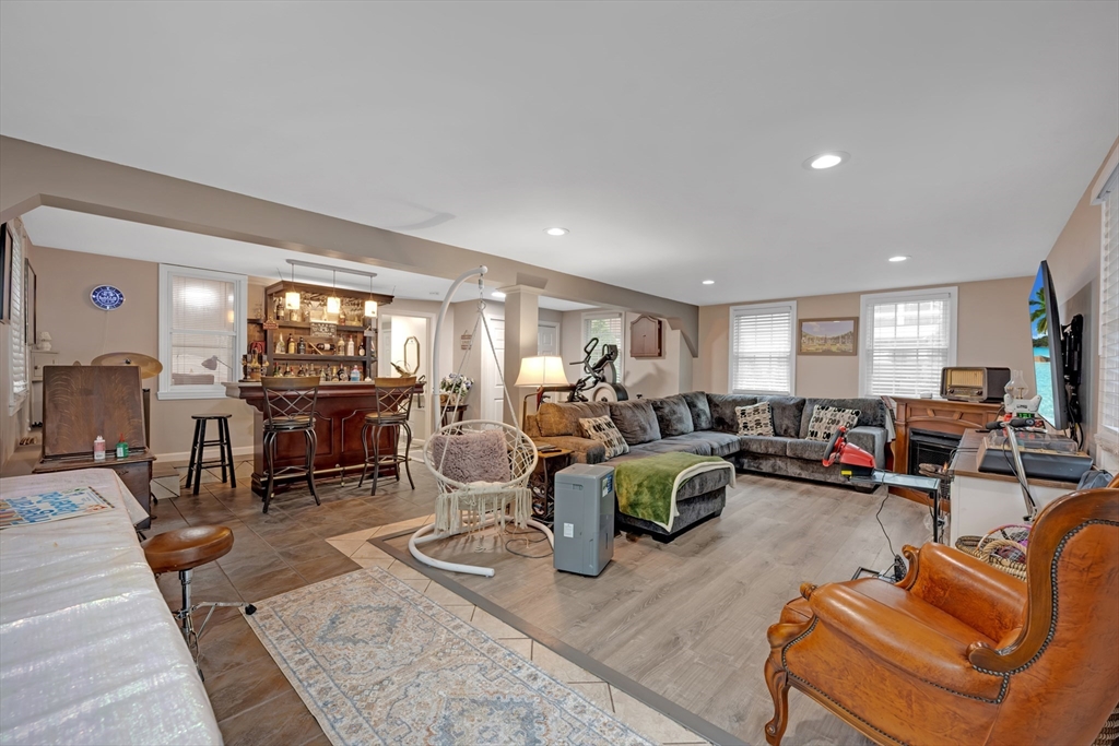 156 Olean Street Worcester, MA 01602 - Photo 27 of 37 a living room with furniture and a dining table with kitchen view