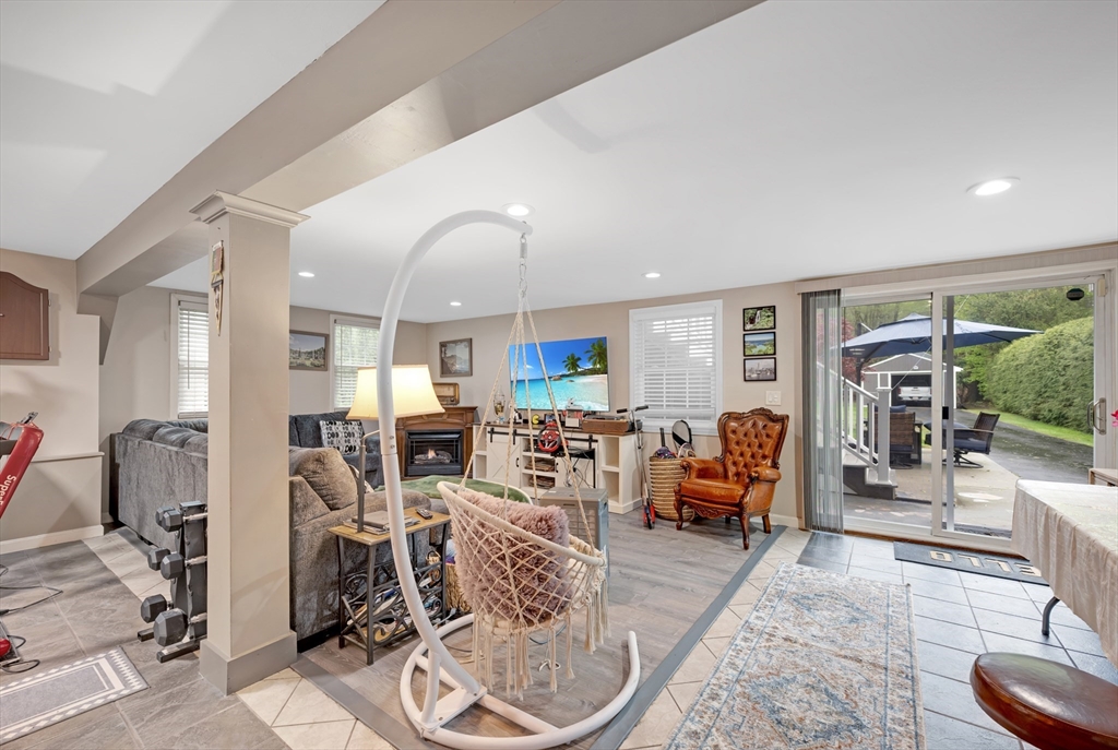 156 Olean Street Worcester, MA 01602 - Photo 28 of 37 a living room with furniture large window and wooden floor