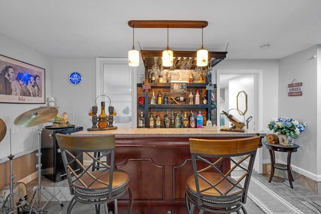 156 Olean Street Worcester, MA 01602 - Photo 29 of 37 a table and chairs in a room