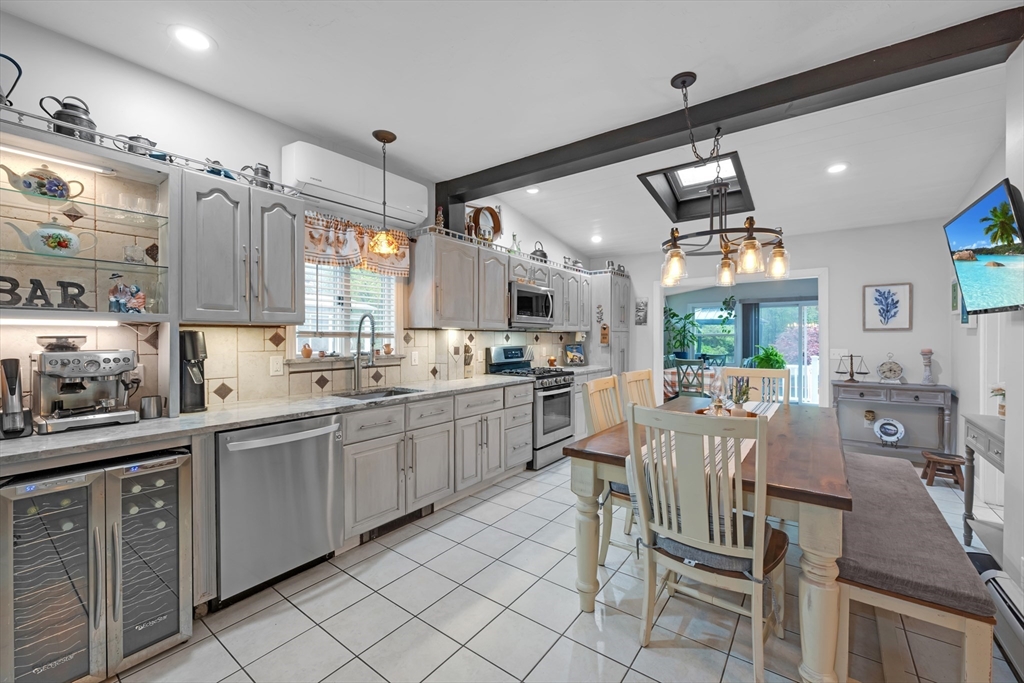 156 Olean Street Worcester, MA 01602 - Photo 7 of 37 a large kitchen with lots of counter space and appliances