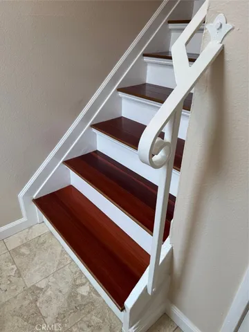 a view of hallway with wooden floor