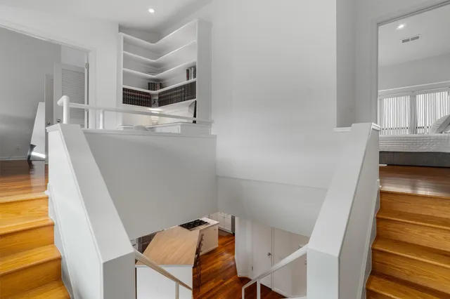 a kitchen with granite countertop a stove and a refrigerator