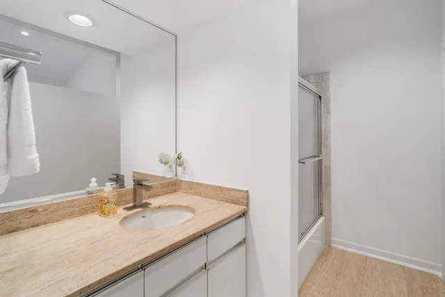 a bathroom with a sink and a mirror