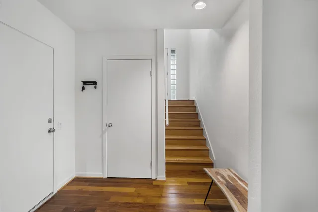 a view of entryway with wooden floor