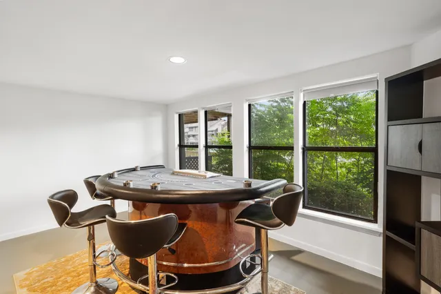 a dining room with furniture and windows
