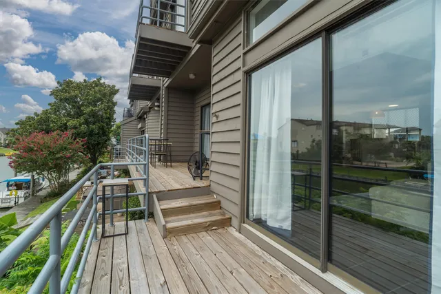 a view of balcony with wooden floor and outdoor space
