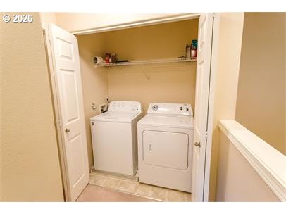 12820 Southwest Dipper Lane, Unit 100 Beaverton, OR 97007 - Photo 16 of 18 a utility room with dryer and washer
