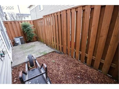 12820 Southwest Dipper Lane, Unit 100 Beaverton, OR 97007 - Photo 17 of 18 a view of a backyard with wooden fence
