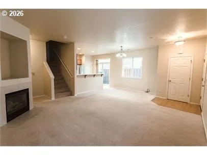 a view of a livingroom with furniture and a fireplace