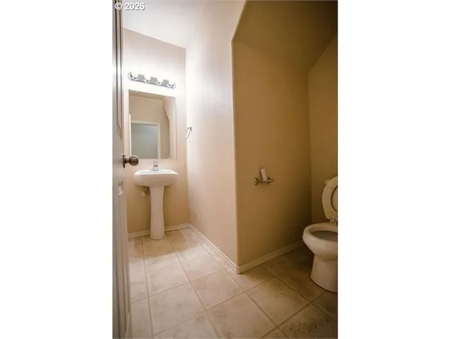 a bathroom with a toilet and a sink