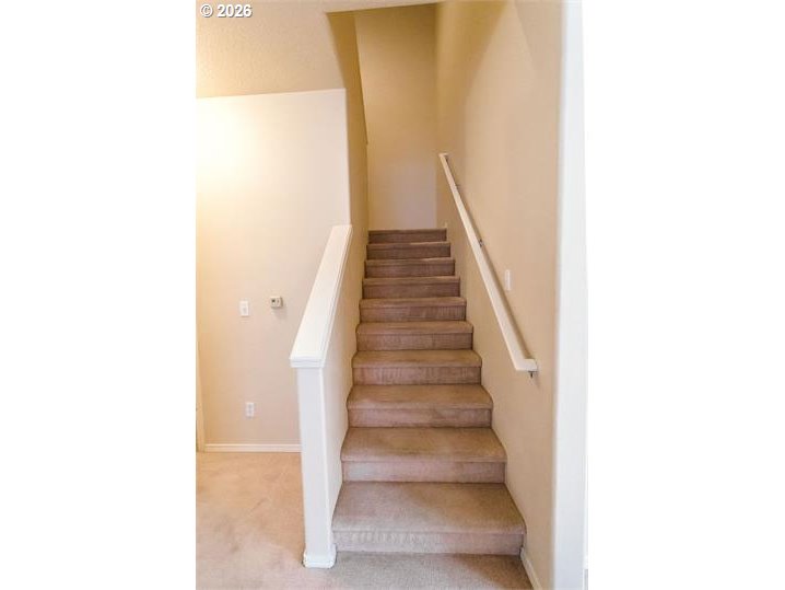 12820 Southwest Dipper Lane, Unit 100 Beaverton, OR 97007 - Photo 10 of 18 a view of staircase with white walls and white door