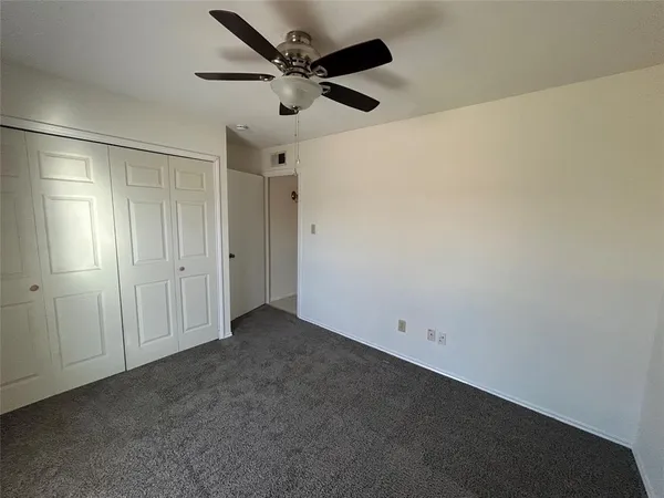 a view of hallway with wooden floor