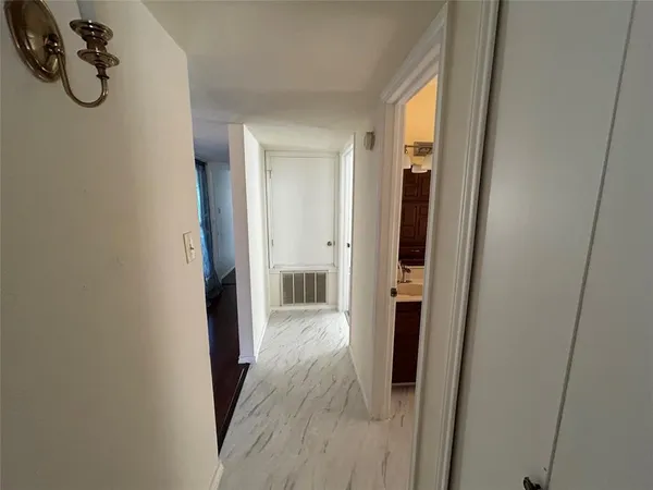 a bathroom with a double vanity sink and shower