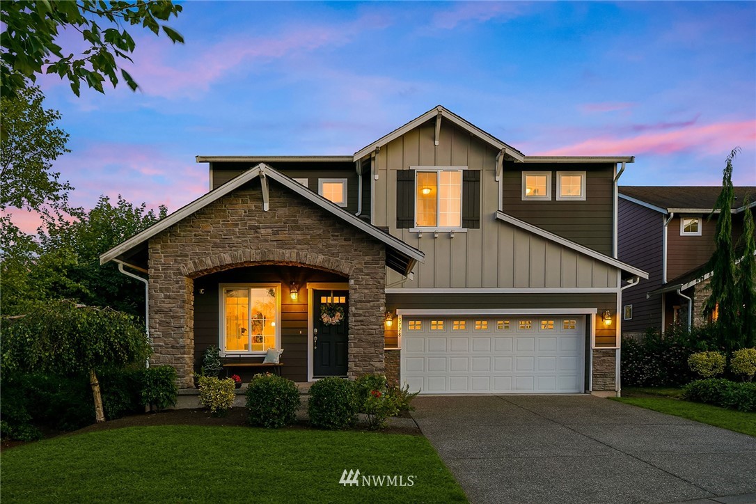 3728 224th Street Southeast Bothell, WA 98021 - Photo 1 of 22 a front view of a house with a yard and garage