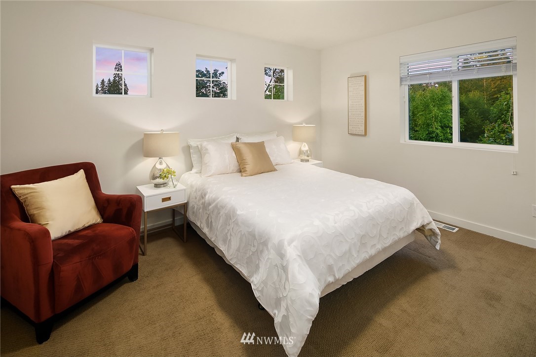 3728 224th Street Southeast Bothell, WA 98021 - Photo 11 of 22 a bedroom with bed and a large window