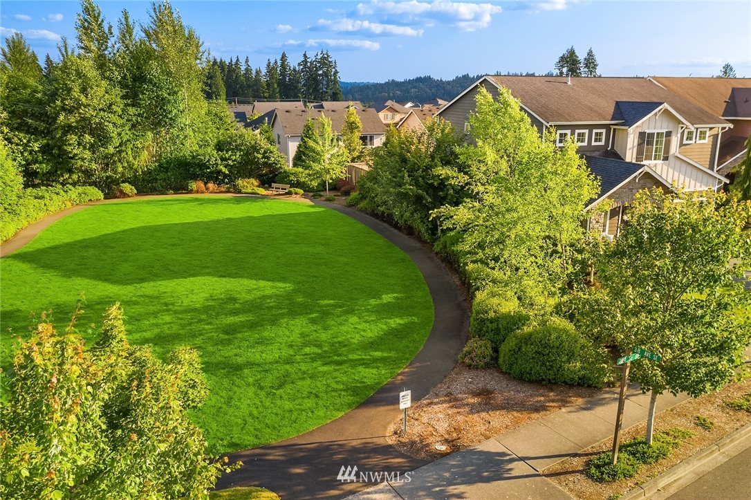 3728 224th Street Southeast Bothell, WA 98021 - Photo 19 of 22 a view of a big house with a big yard plants and large trees