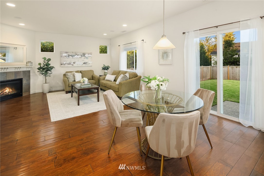 3728 224th Street Southeast Bothell, WA 98021 - Photo 3 of 22 a view of a dining room with furniture window and wooden floor