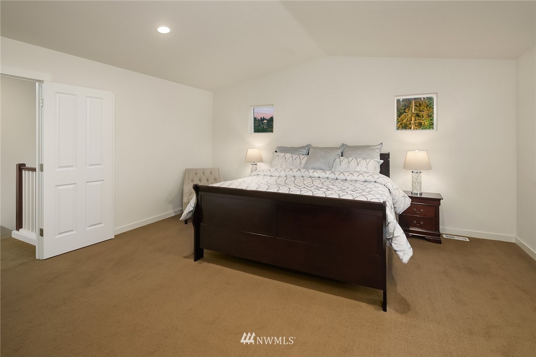 3728 224th Street Southeast Bothell, WA 98021 - Photo 7 of 22 a bedroom with a bed and a cabinets