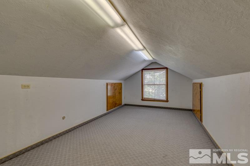 935 Vine Street Reno, NV 89503 - Photo 12 of 18 a view of an empty room with window and wooden floor