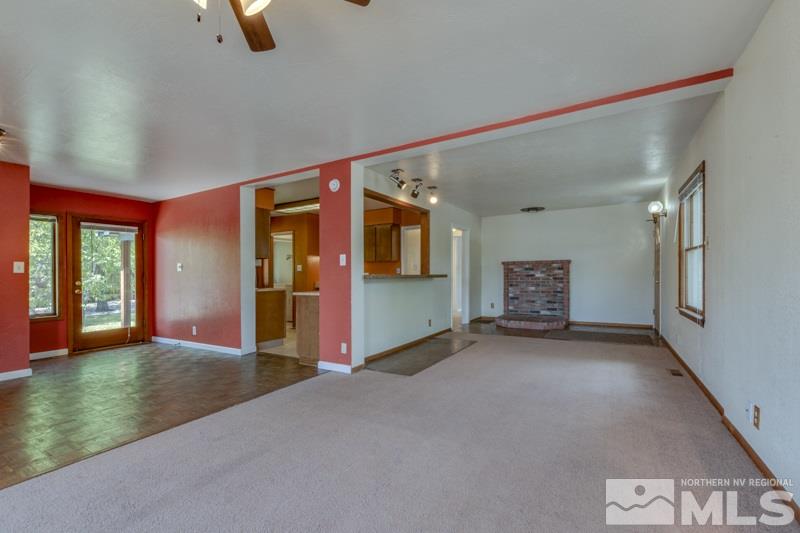 935 Vine Street Reno, NV 89503 - Photo 4 of 18 wooden floor in an empty room with a window