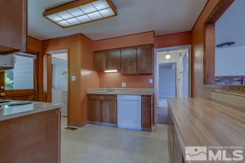 935 Vine Street Reno, NV 89503 - Photo 5 of 18 a view of a kitchen cabinets and a wooden floor