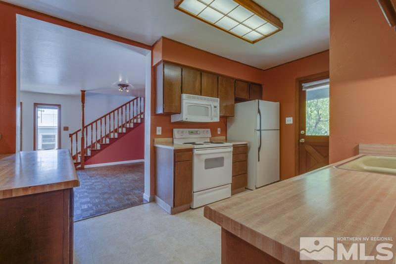 935 Vine Street Reno, NV 89503 - Photo 6 of 18 a kitchen with refrigerator and stove