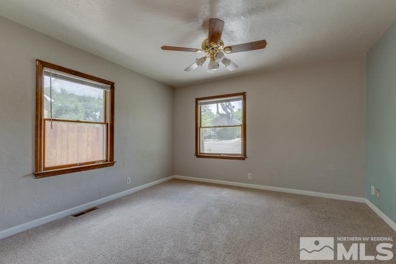 935 Vine Street Reno, NV 89503 - Photo 8 of 18 an empty room with windows and fan