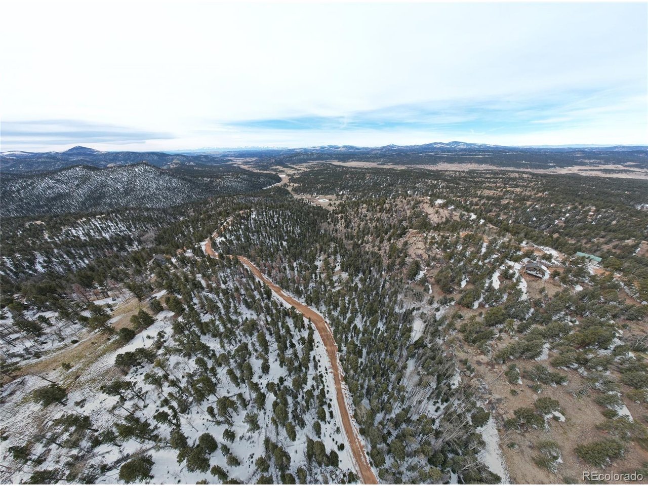 3388 North Mountain Estates Road Florissant, CO 80816 - Photo 35 of 36 an aerial view of houses covered in trees
