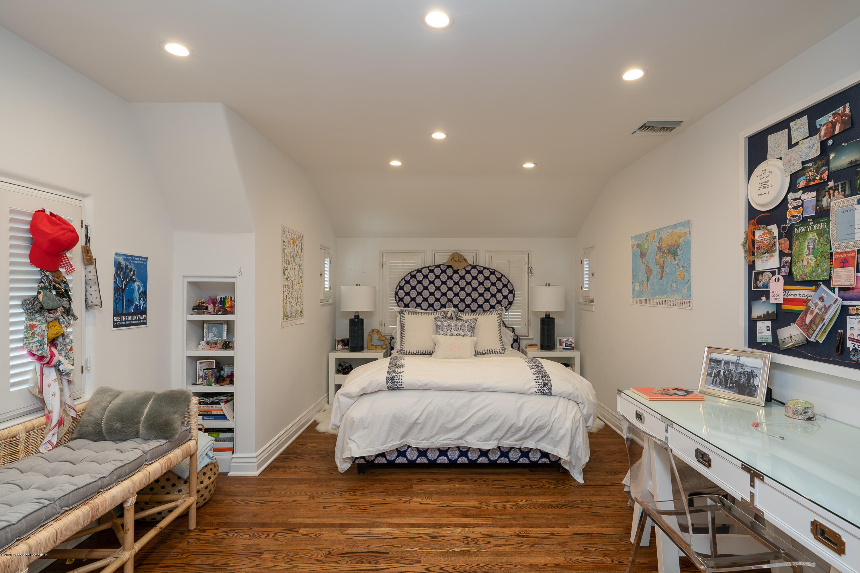 700 Laguna Road Pasadena, CA 91105 - Photo 17 of 31 a bedroom with a bed and a bookshelf