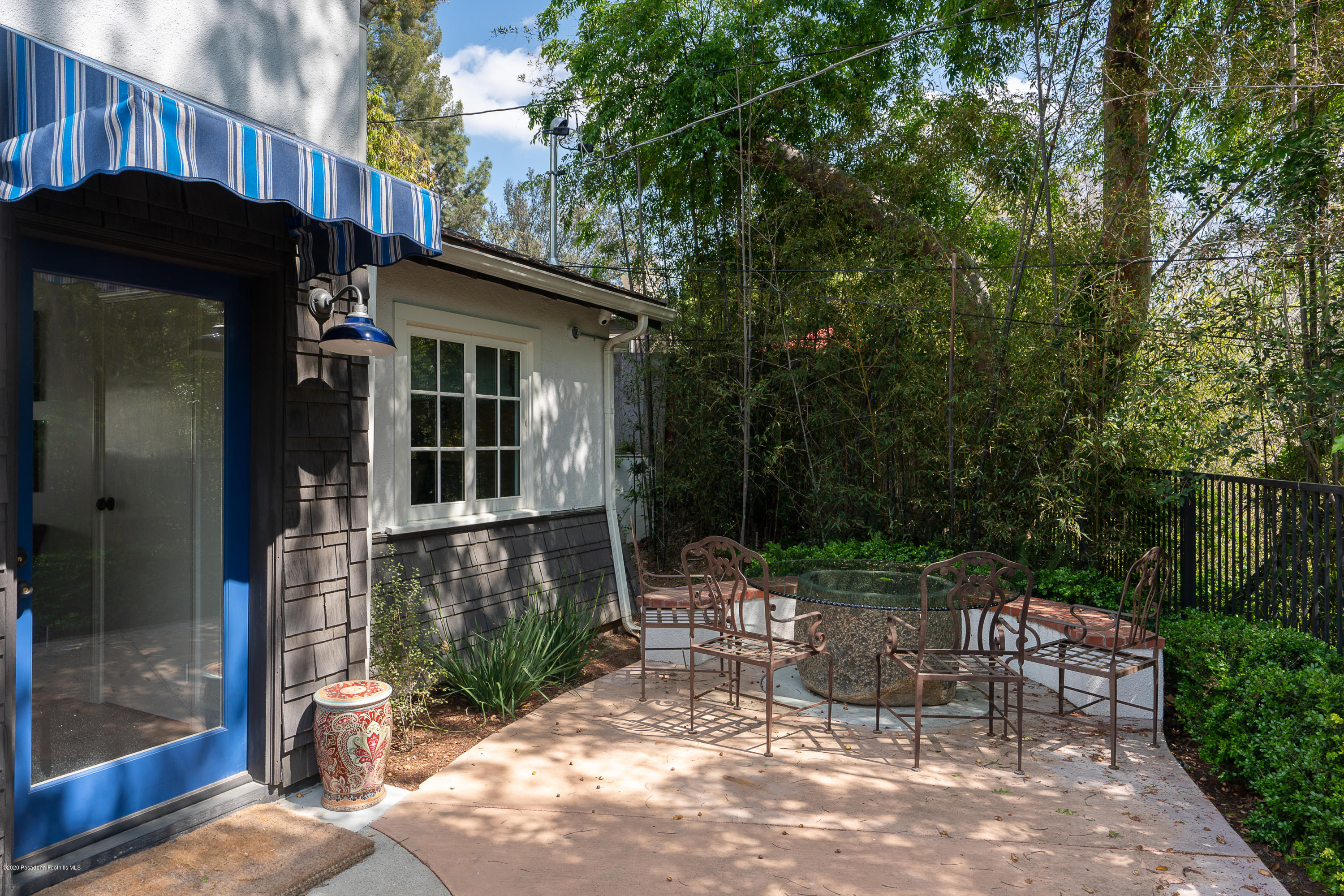 700 Laguna Road Pasadena, CA 91105 - Photo 21 of 31 a view of a chair and table in backyard of the house