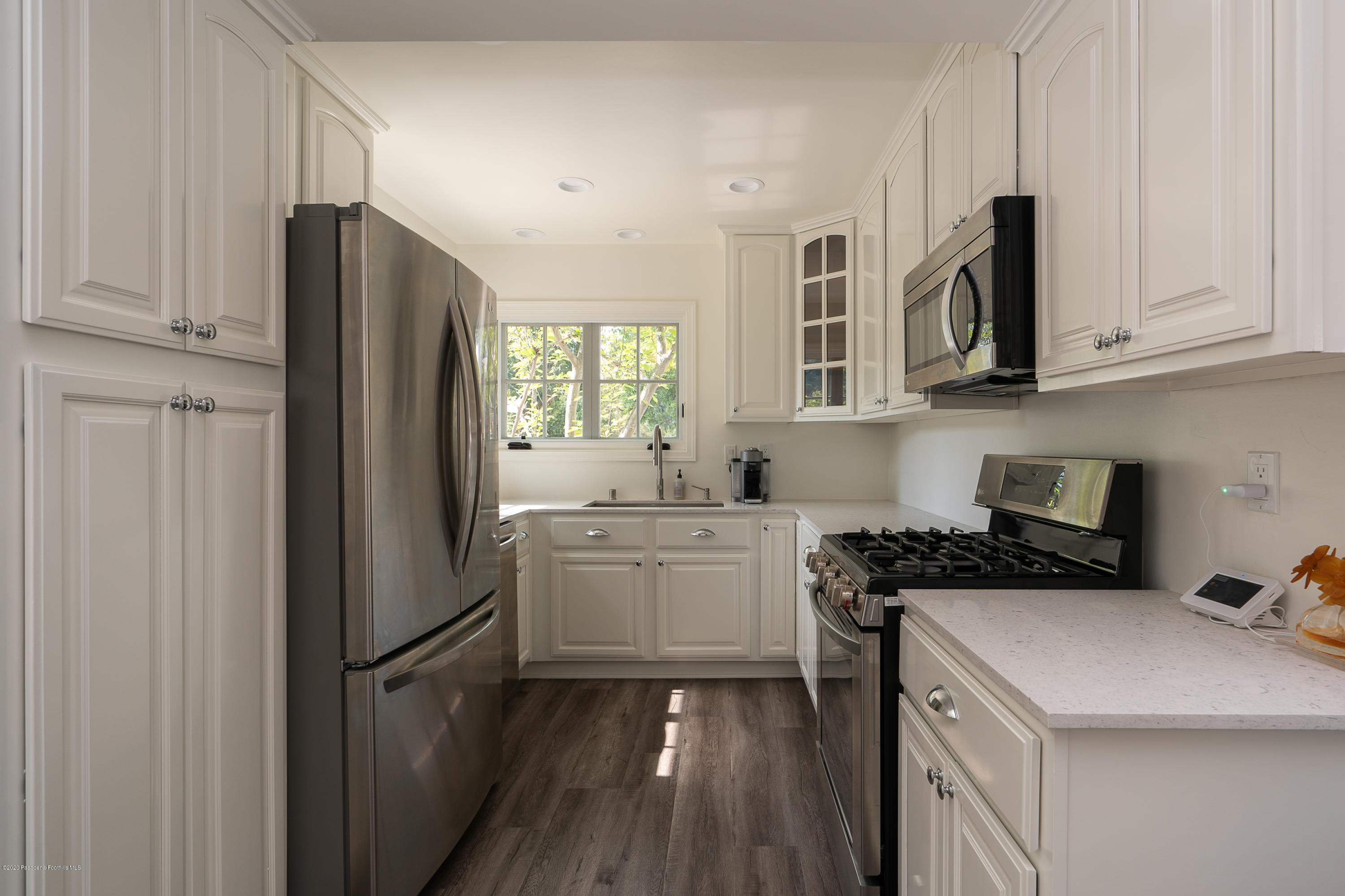 700 Laguna Road Pasadena, CA 91105 - Photo 23 of 31 a kitchen with a refrigerator sink and cabinets