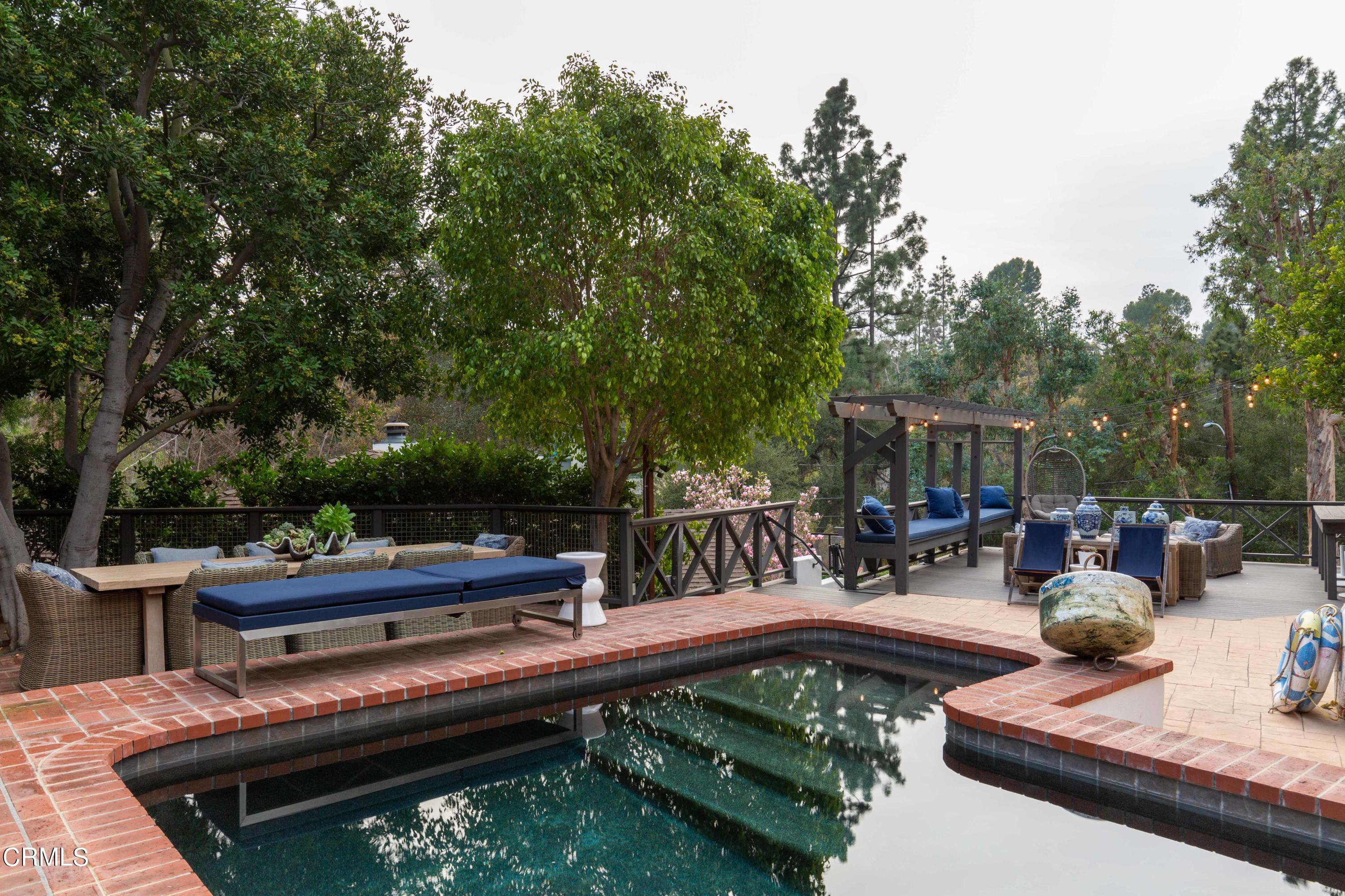 700 Laguna Road Pasadena, CA 91105 - Photo 26 of 31 a view of a patio with chairs and a table