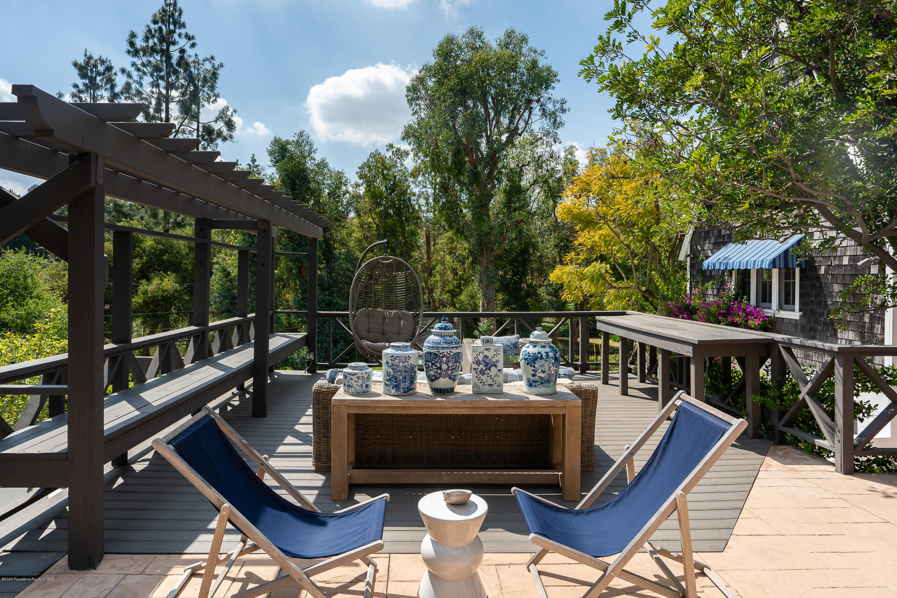 700 Laguna Road Pasadena, CA 91105 - Photo 27 of 31 a view of a balcony with chairs and wooden floor