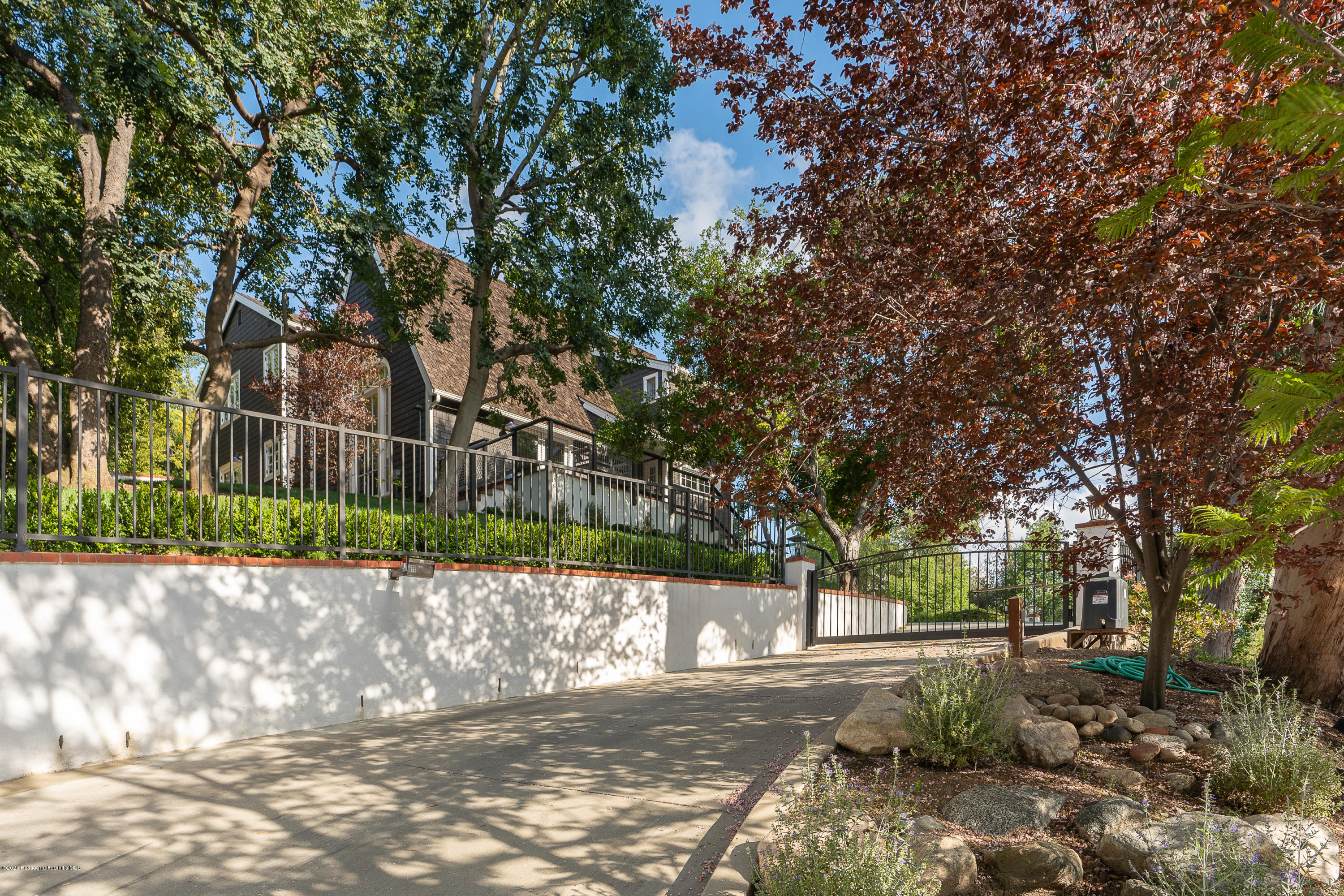 700 Laguna Road Pasadena, CA 91105 - Photo 31 of 31 a view of a street with a tree in the background