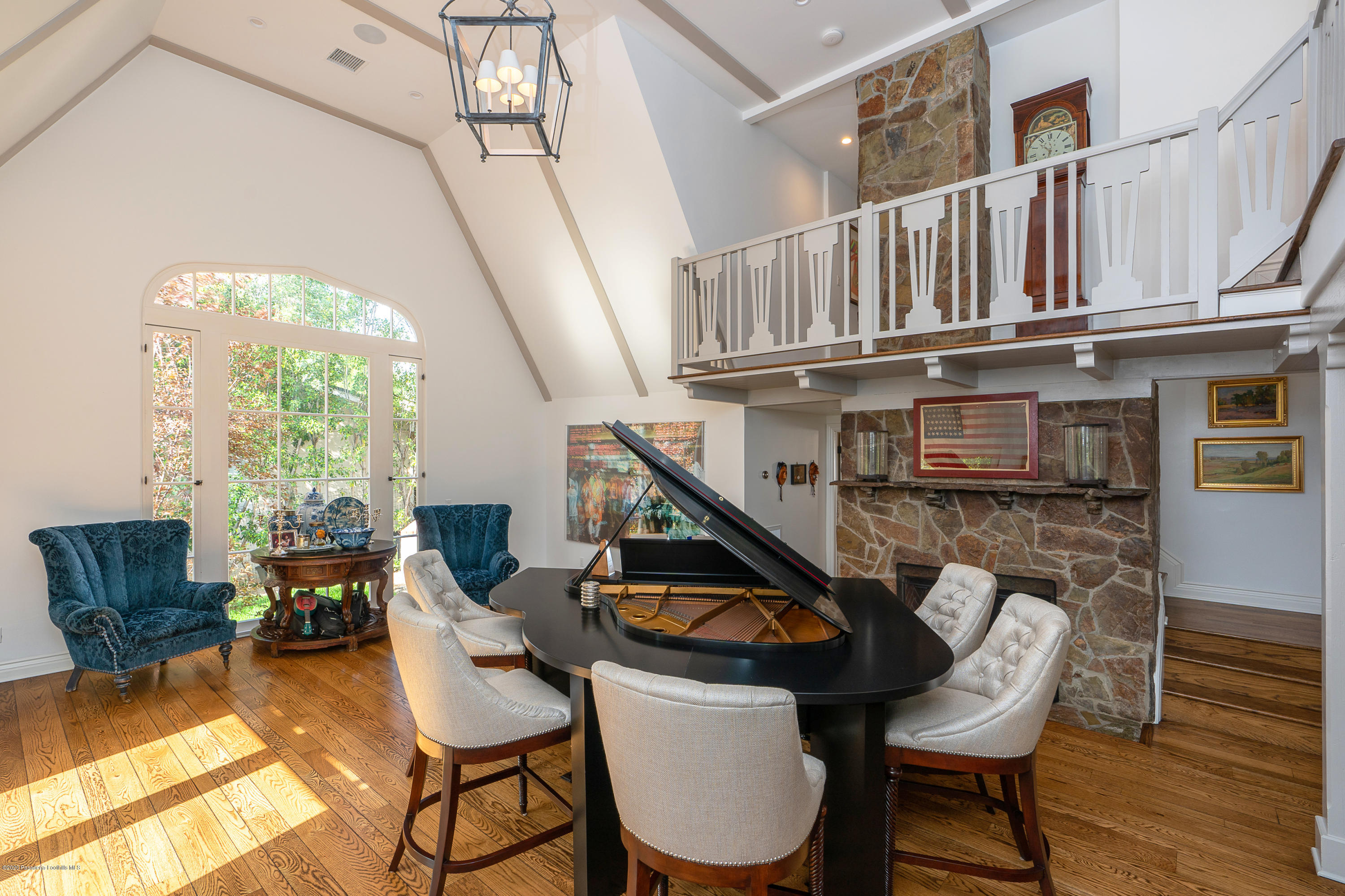 700 Laguna Road Pasadena, CA 91105 - Photo 6 of 31 a living room with furniture a fireplace and a large window