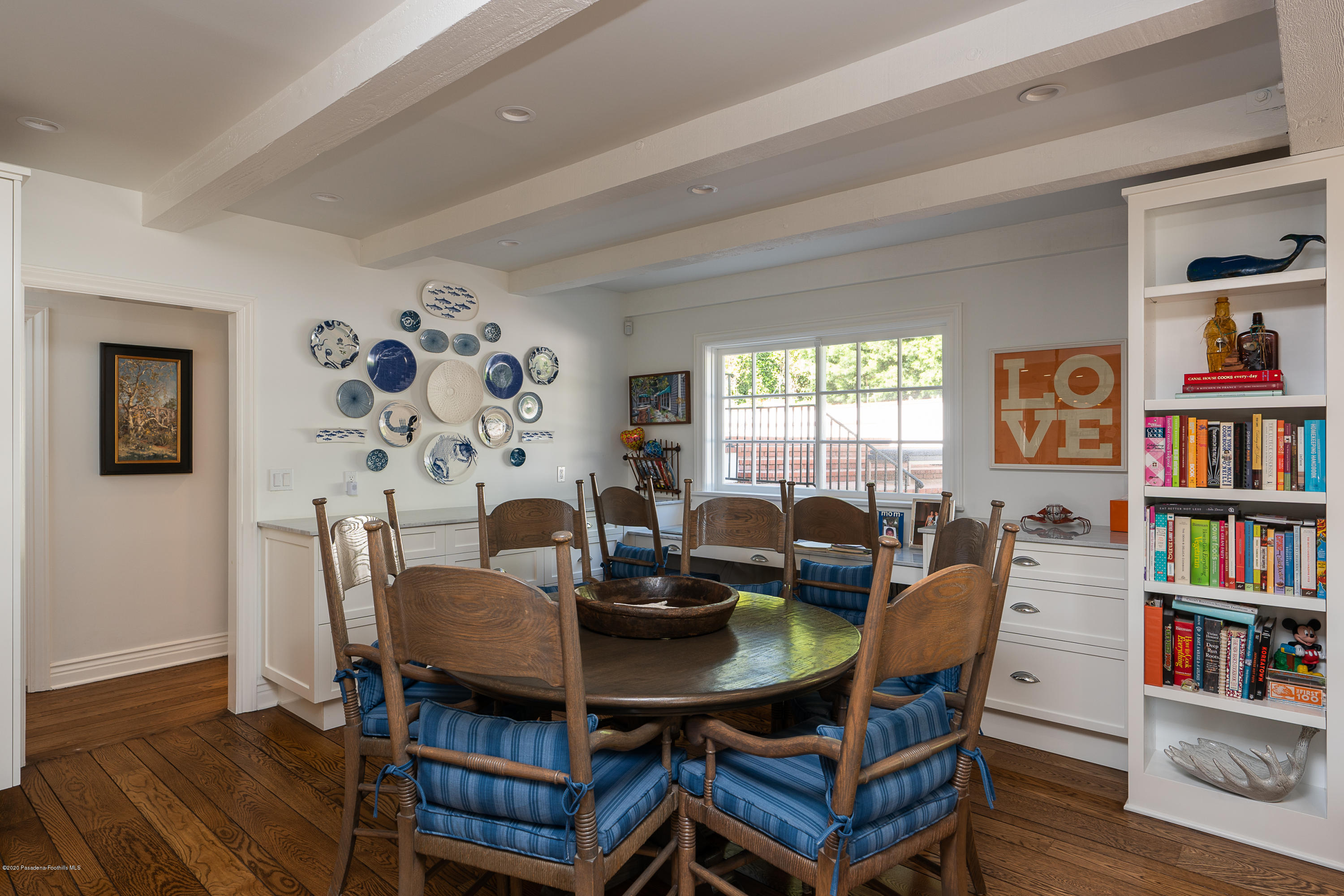 700 Laguna Road Pasadena, CA 91105 - Photo 10 of 31 a view of a dining room with furniture and a bookshelf
