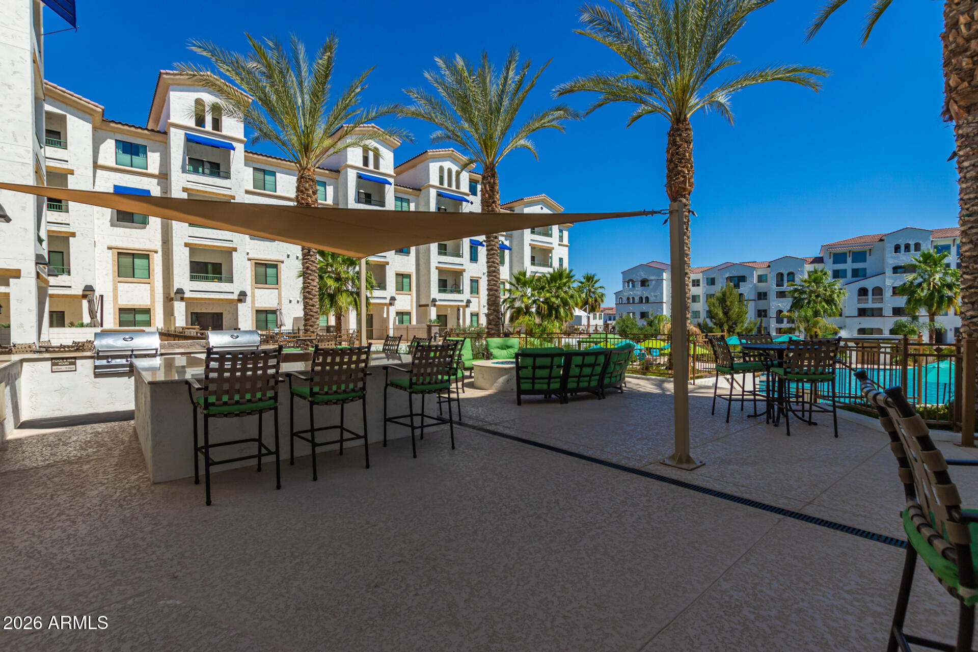 2511 West Queen Creek Road, Unit 279 Chandler, AZ 85248 - Photo 30 of 35 a view of a chairs and table in the patio