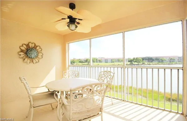 a view of a living room and a floor to ceiling window