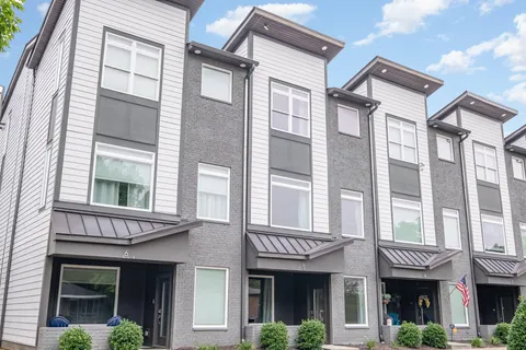 a front view of a brick building with a lot of windows
